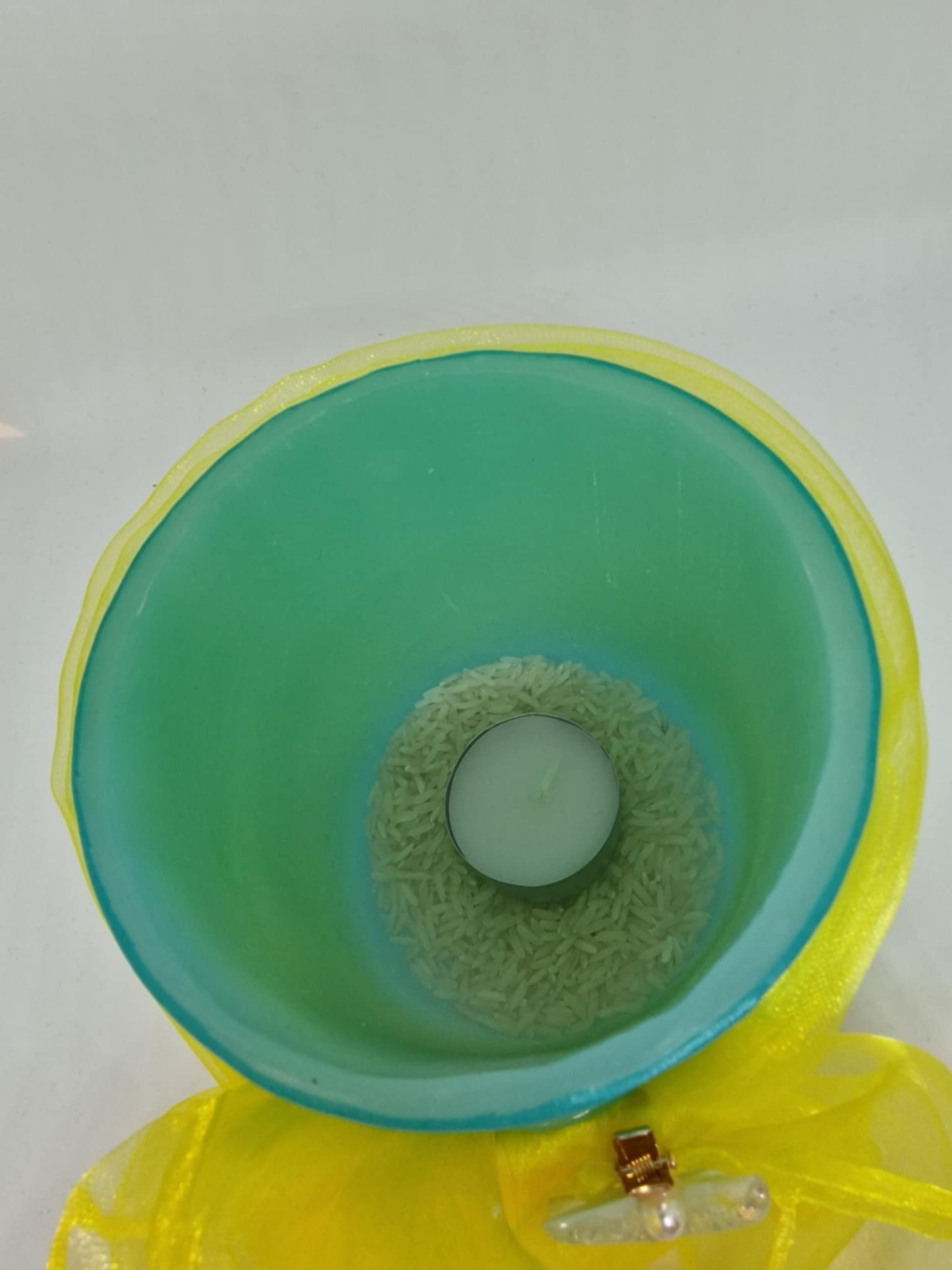 Licht groen kaarslantaarn met sjaal en zeester